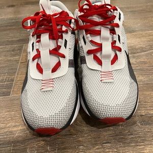 Red white and black mens Nike shoes size 10.5.